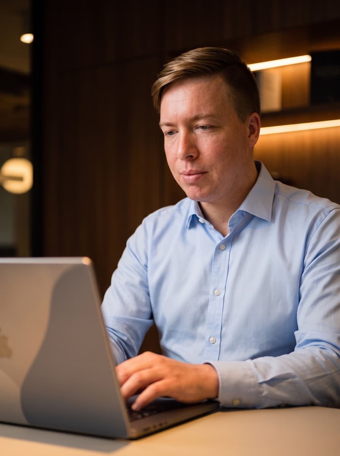 Dennis Brumley working at a laptop